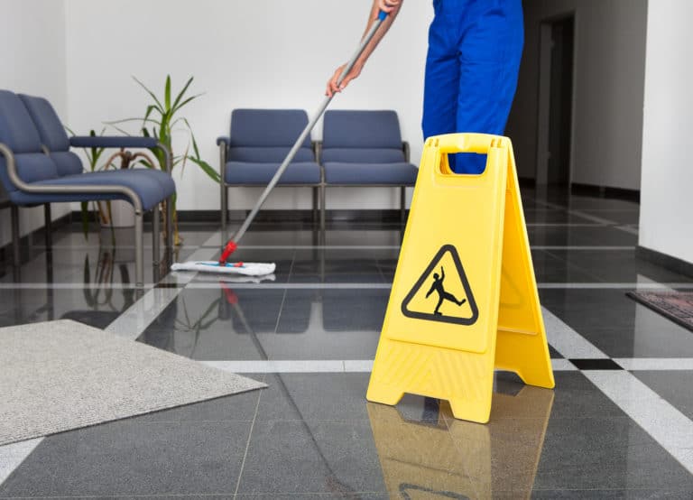 Cleaning staff cleaning floor