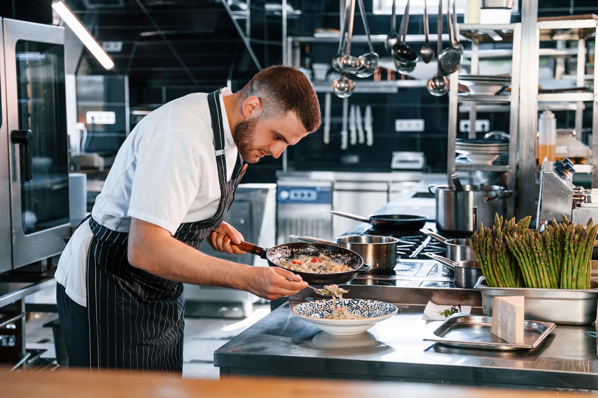 chef plating in spotless kitchen