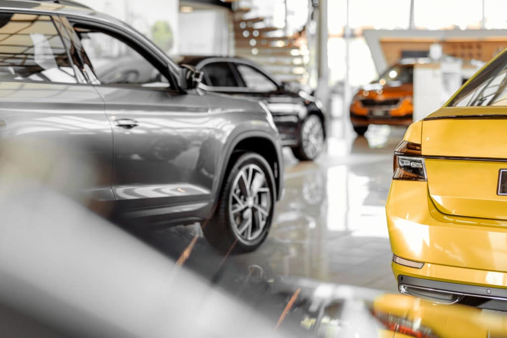 Cars parked in luxury car showroom