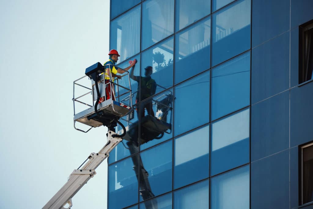 reaching high-rise windows with specialist window cleaning equipment